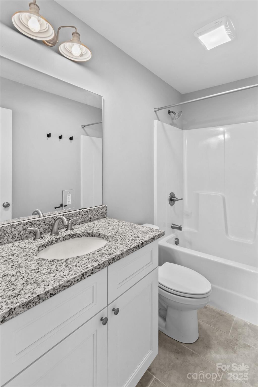 2518 Moose Road Kannapolis, NC 28083 - Photo 40 of 47 a bathroom with a granite countertop sink a toilet and a bathtub