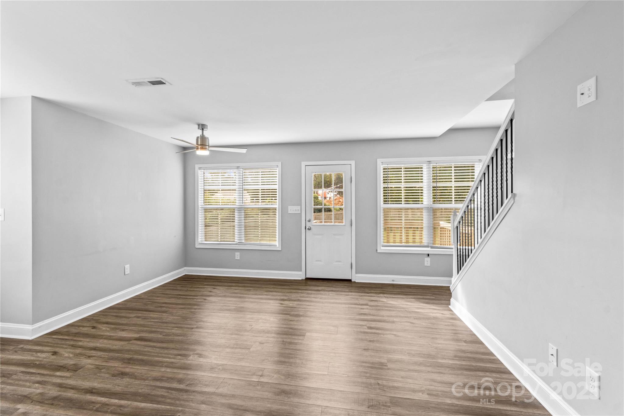 2518 Moose Road Kannapolis, NC 28083 - Photo 5 of 47 a view of an empty room with wooden floor and windows
