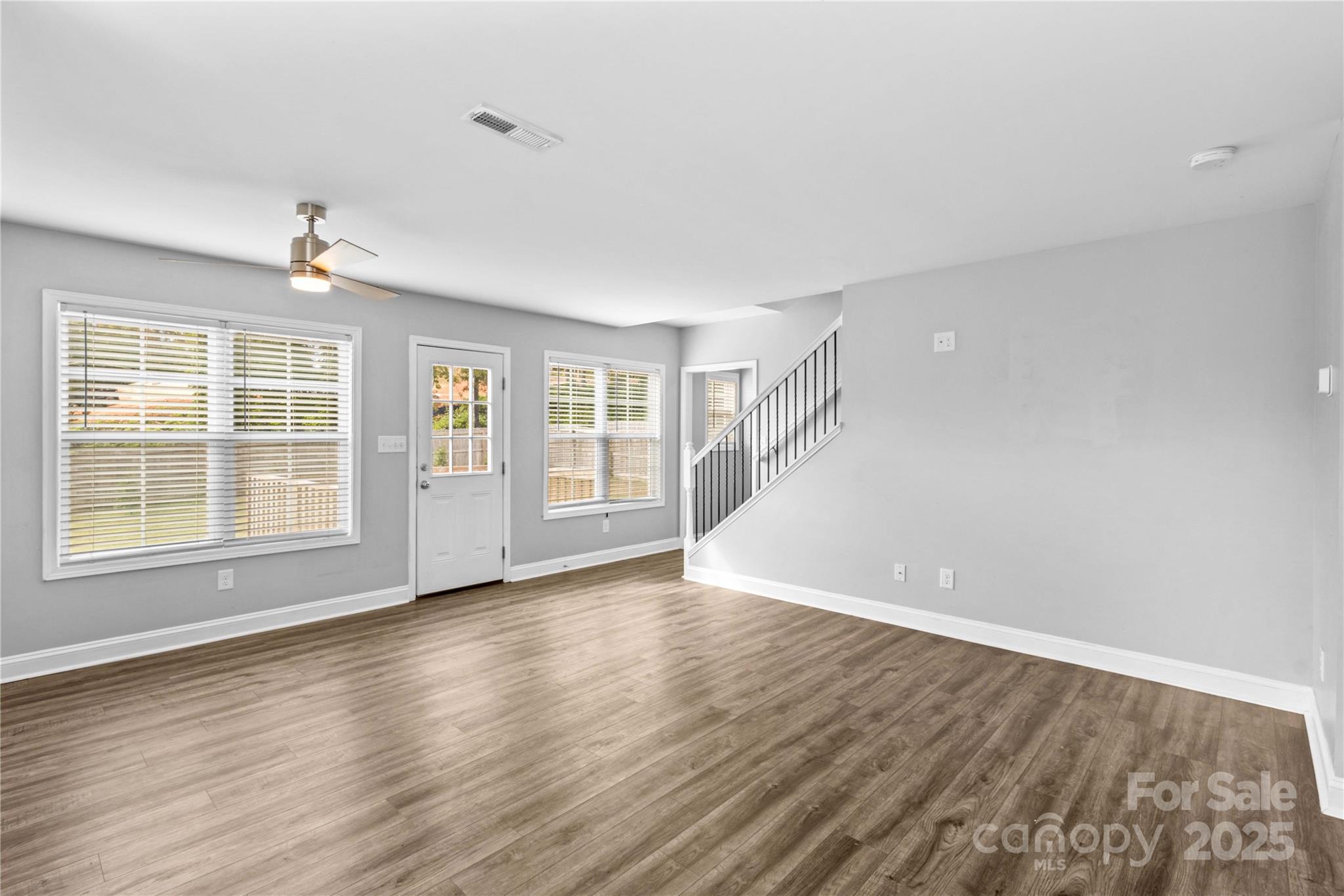 2518 Moose Road Kannapolis, NC 28083 - Photo 7 of 47 a view of an empty room with wooden floor and a window