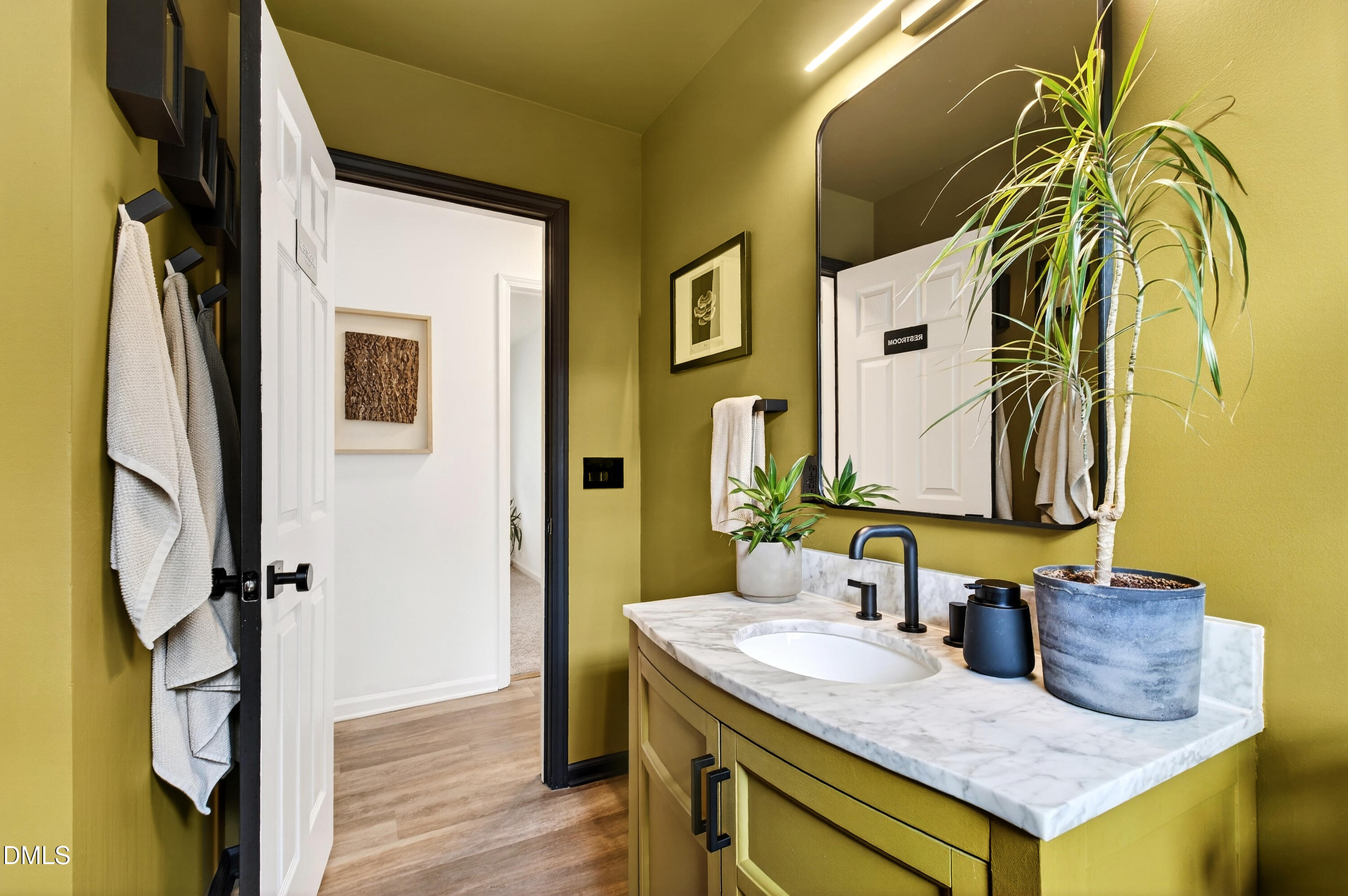917 Carlisle Street Raleigh, NC 27610 - Photo 15 of 33 a bathroom with a granite countertop sink and a mirror