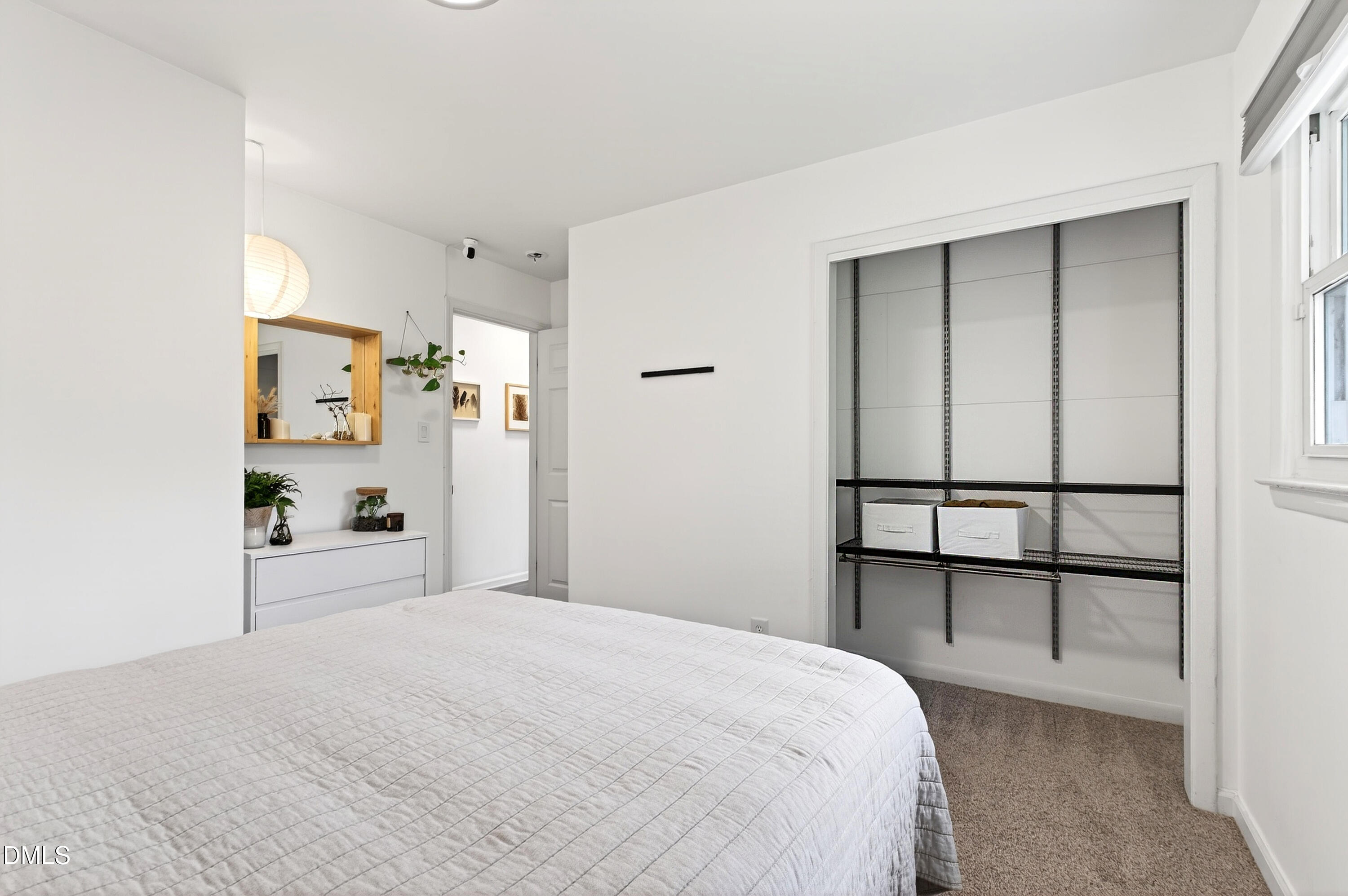 917 Carlisle Street Raleigh, NC 27610 - Photo 19 of 33 a bedroom with a bed and a window