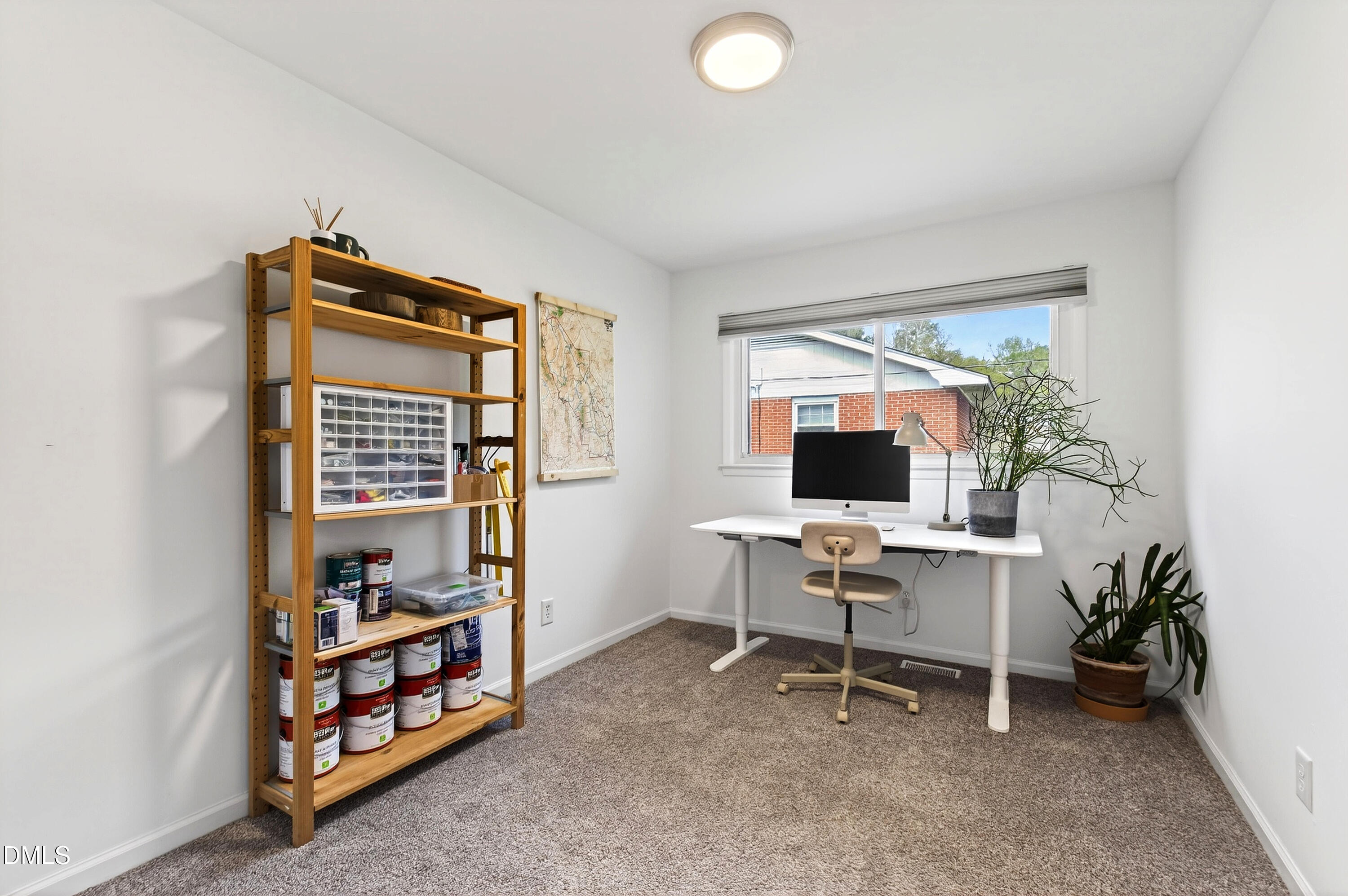 917 Carlisle Street Raleigh, NC 27610 - Photo 26 of 33 a workspace with furniture and a window