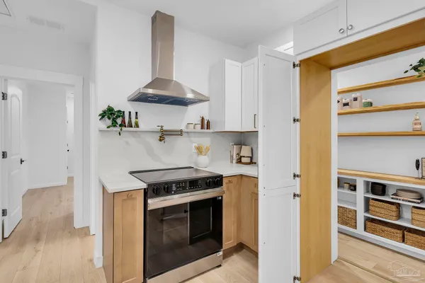 a kitchen with stainless steel appliances a stove and a refrigerator