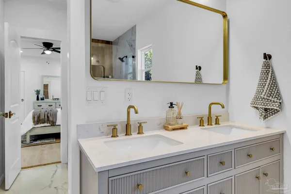 a bathroom with a sink and a mirror