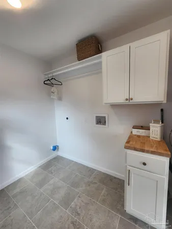 a room with cabinets and appliances