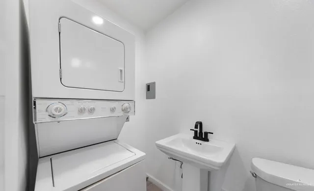 a bathroom with a sink a mirror and a toilet