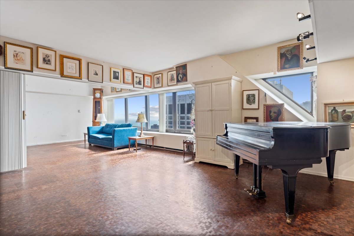 175 East Delaware Place, Unit 7008 Chicago, IL 60611 - Photo 11 of 28 a view of a livingroom with furniture and staircase