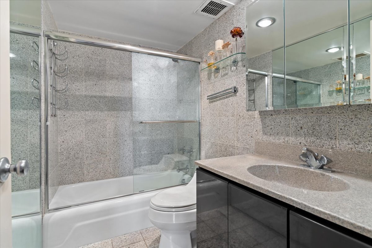 175 East Delaware Place, Unit 7008 Chicago, IL 60611 - Photo 20 of 28 a bathroom with a sink toilet and shower