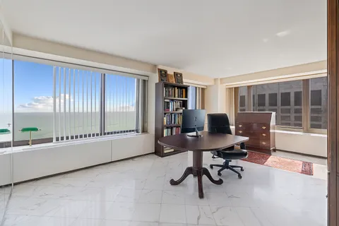 a workspace with furniture and a window