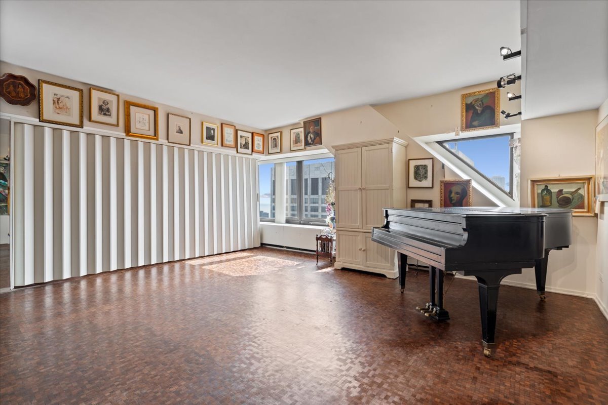 175 East Delaware Place, Unit 7008 Chicago, IL 60611 - Photo 10 of 28 a view of a livingroom with furniture and staircase