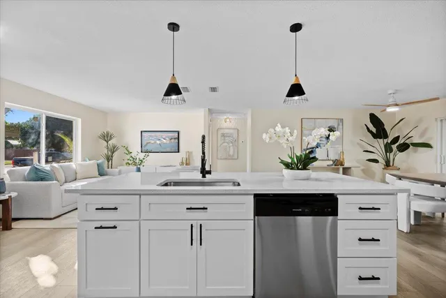 a bedroom with a bed and a potted plant