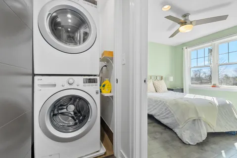 a bedroom with a bed and window