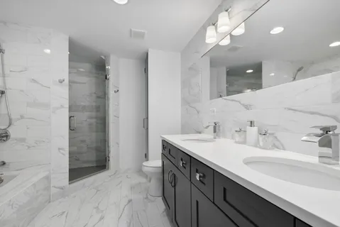 a bathroom with a sink a vanity and a mirror