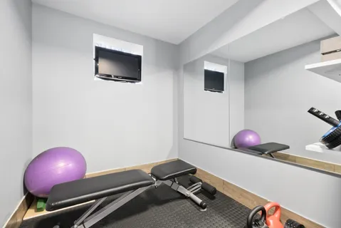 a room with a table and a potted plant