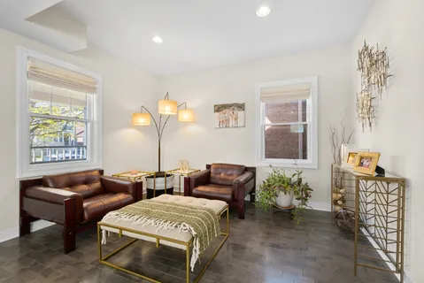 a bedroom with furniture and a window