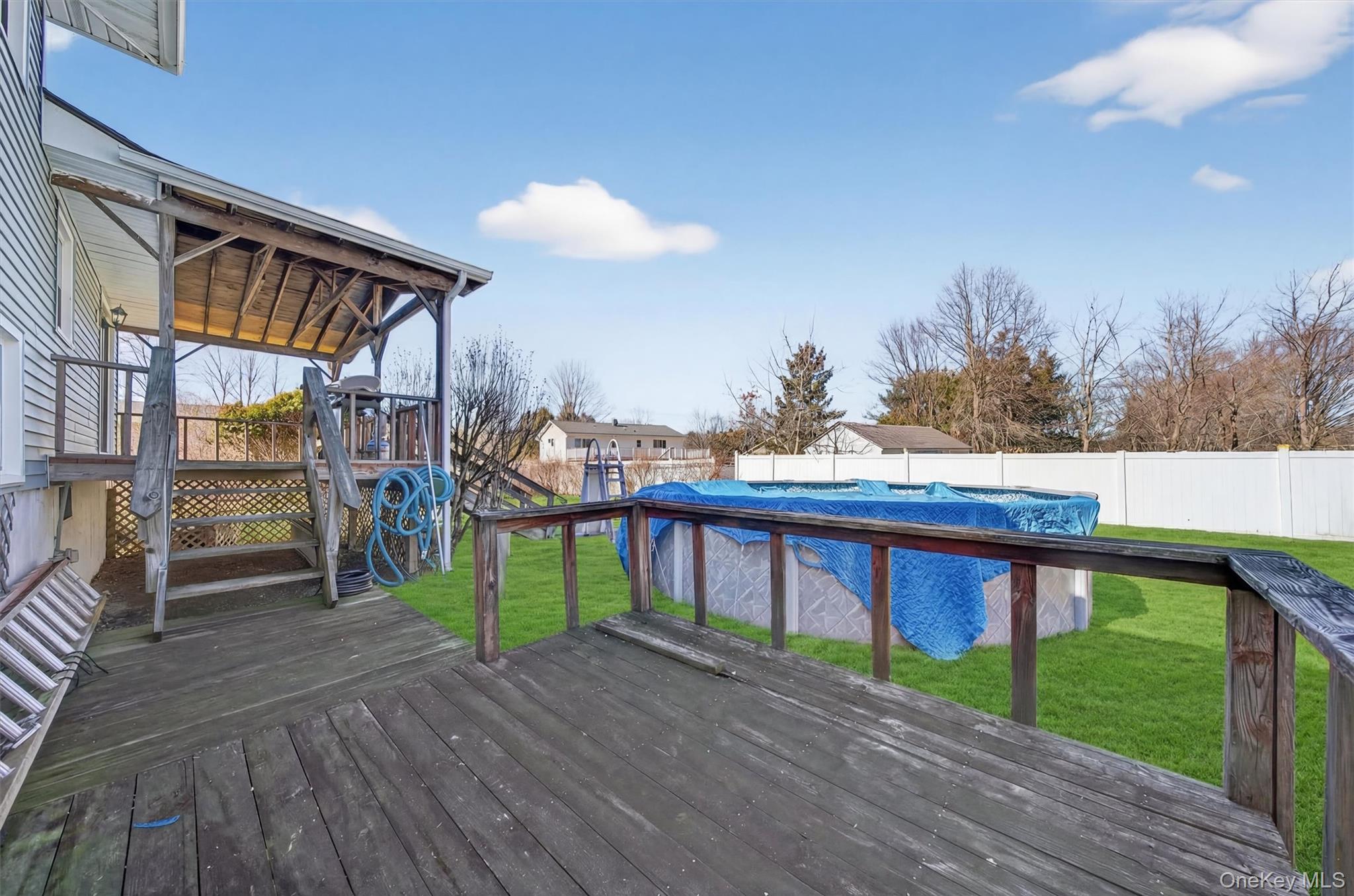 5 Loch Invar Lane Middletown, NY 10941 - Photo 40 of 47 Lower deck showing above ground pool and fence