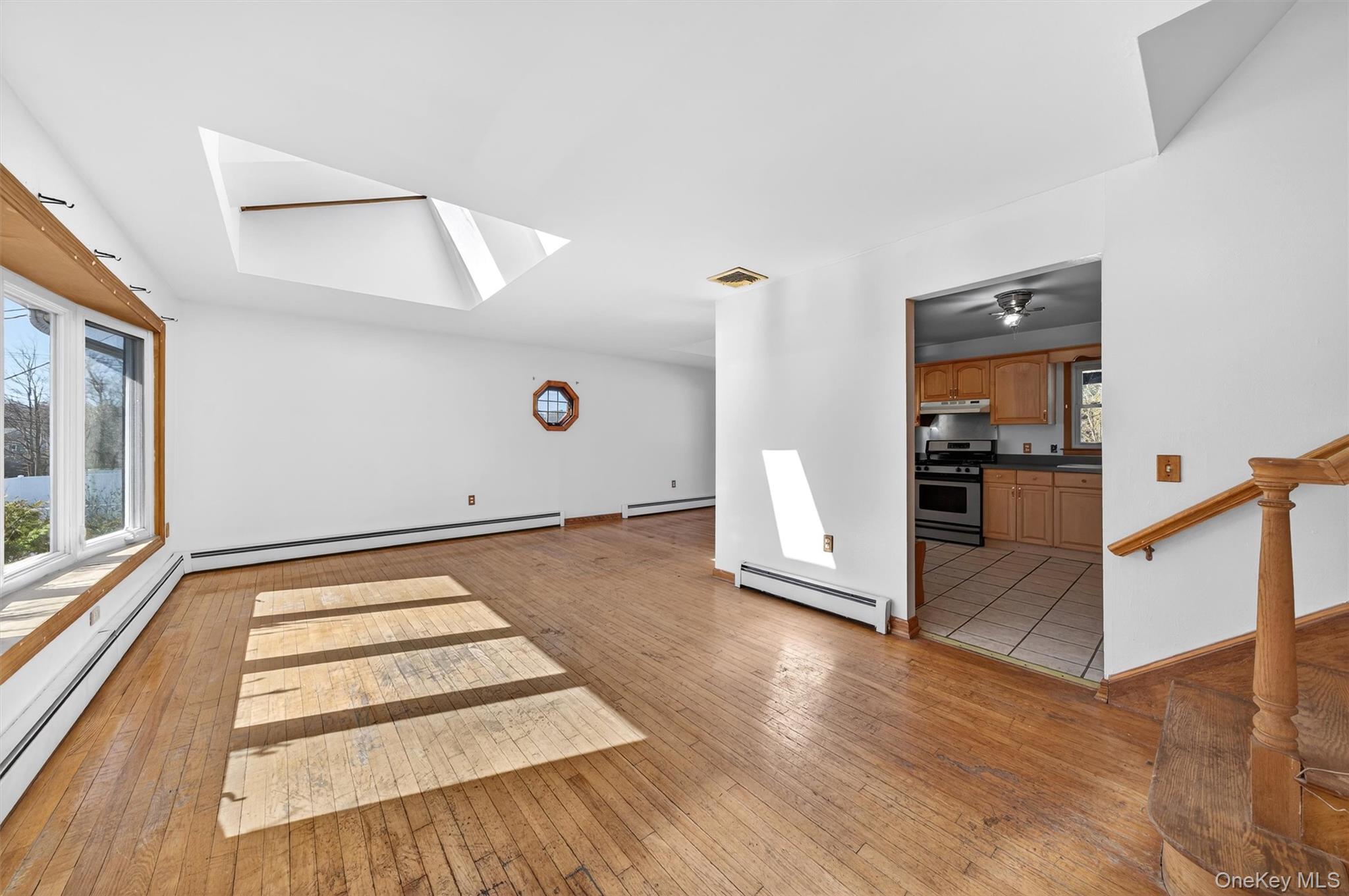5 Loch Invar Lane Middletown, NY 10941 - Photo 5 of 47 Showing living room, kitchen entrance and stairs to bedroom level