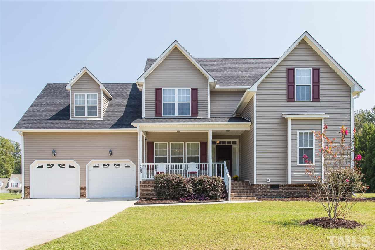 8509 Ridgebury Road Raleigh, NC 27603 - Photo 1 of 30 a front view of a house with a yard
