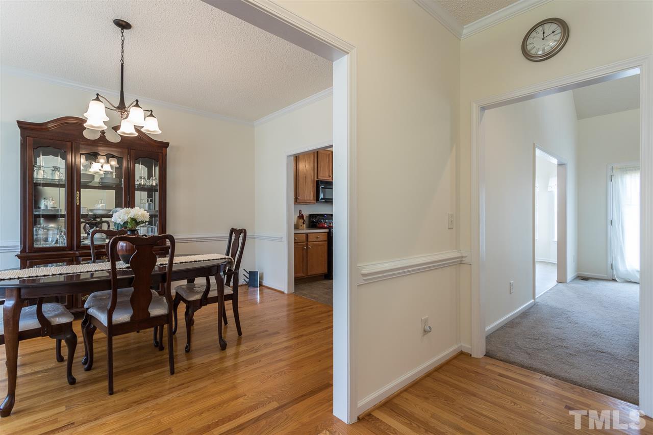 8509 Ridgebury Road Raleigh, NC 27603 - Photo 2 of 30 a view of a dining room with furniture and wooden floor