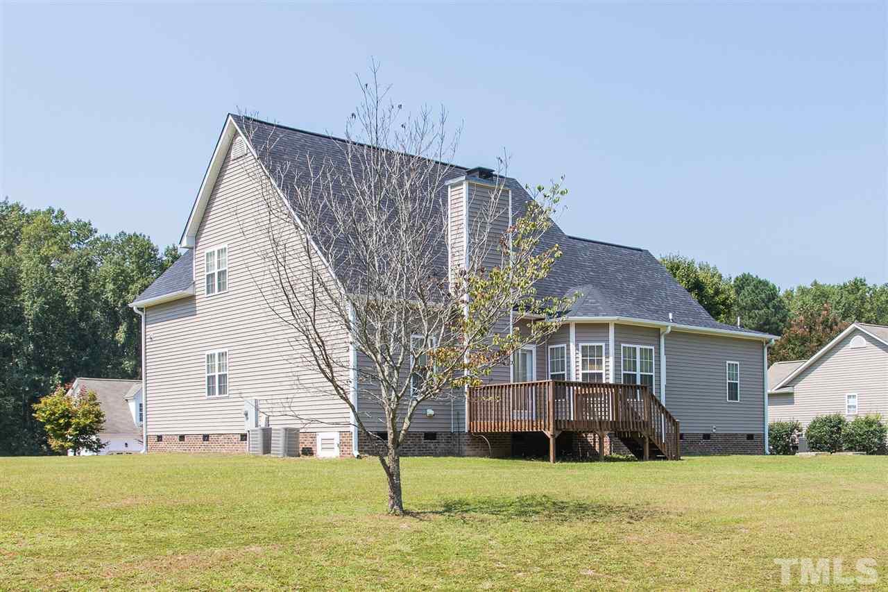 8509 Ridgebury Road Raleigh, NC 27603 - Photo 26 of 30 a view of a house with a yard