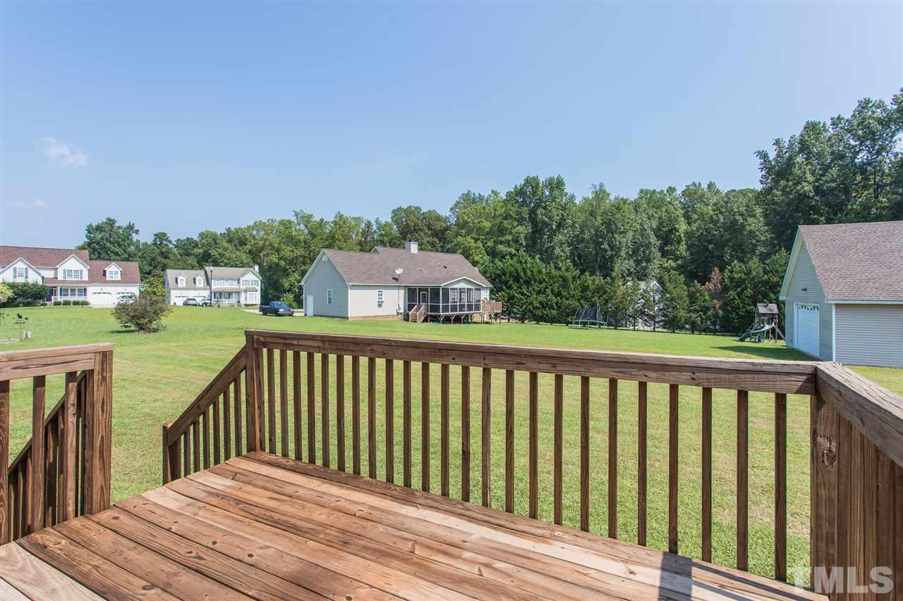8509 Ridgebury Road Raleigh, NC 27603 - Photo 27 of 30 a balcony with trees in front of it