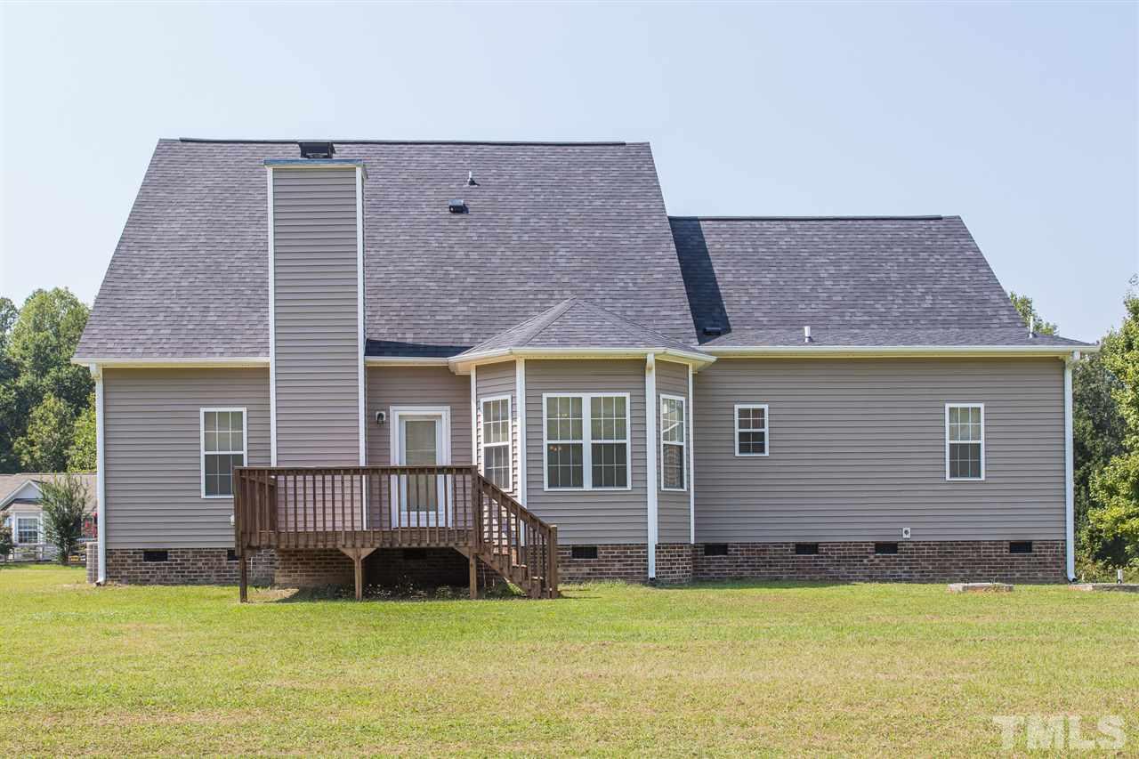 8509 Ridgebury Road Raleigh, NC 27603 - Photo 28 of 30 a view of a house with a yard in front of it