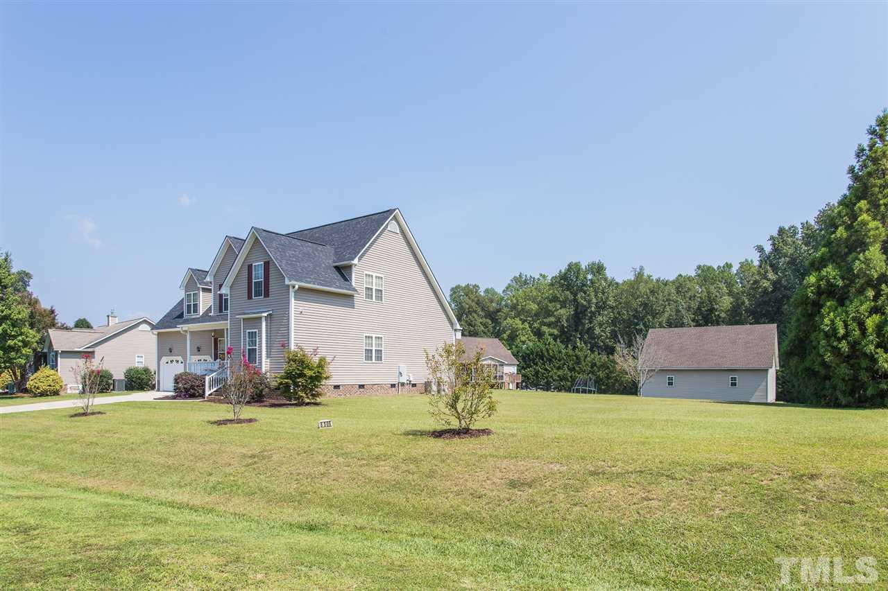 8509 Ridgebury Road Raleigh, NC 27603 - Photo 29 of 30 a view of a house with a big yard