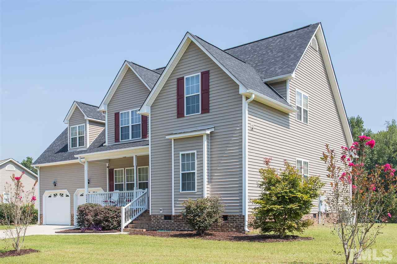 8509 Ridgebury Road Raleigh, NC 27603 - Photo 30 of 30 a front view of a house with a yard and garage