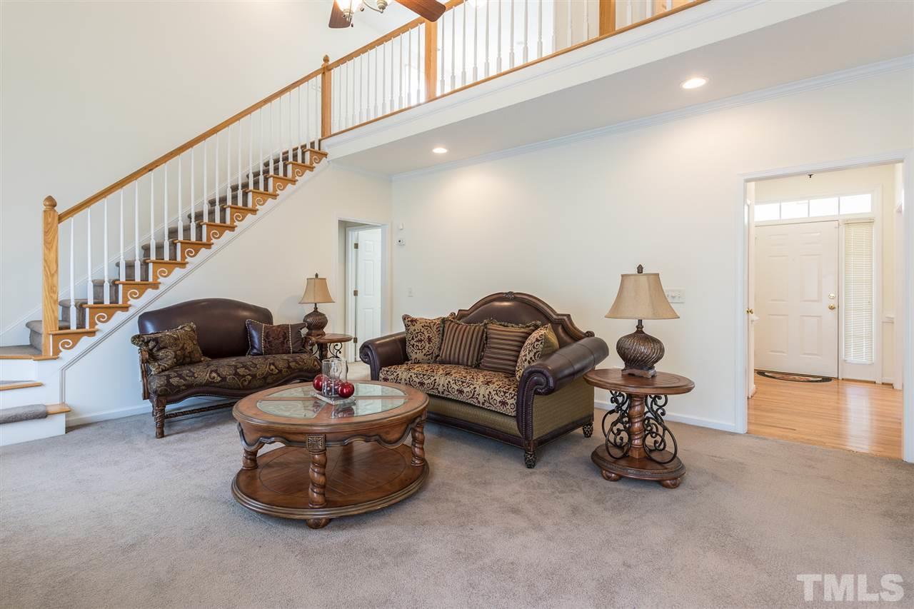 8509 Ridgebury Road Raleigh, NC 27603 - Photo 5 of 30 a living room with furniture and a wooden floor