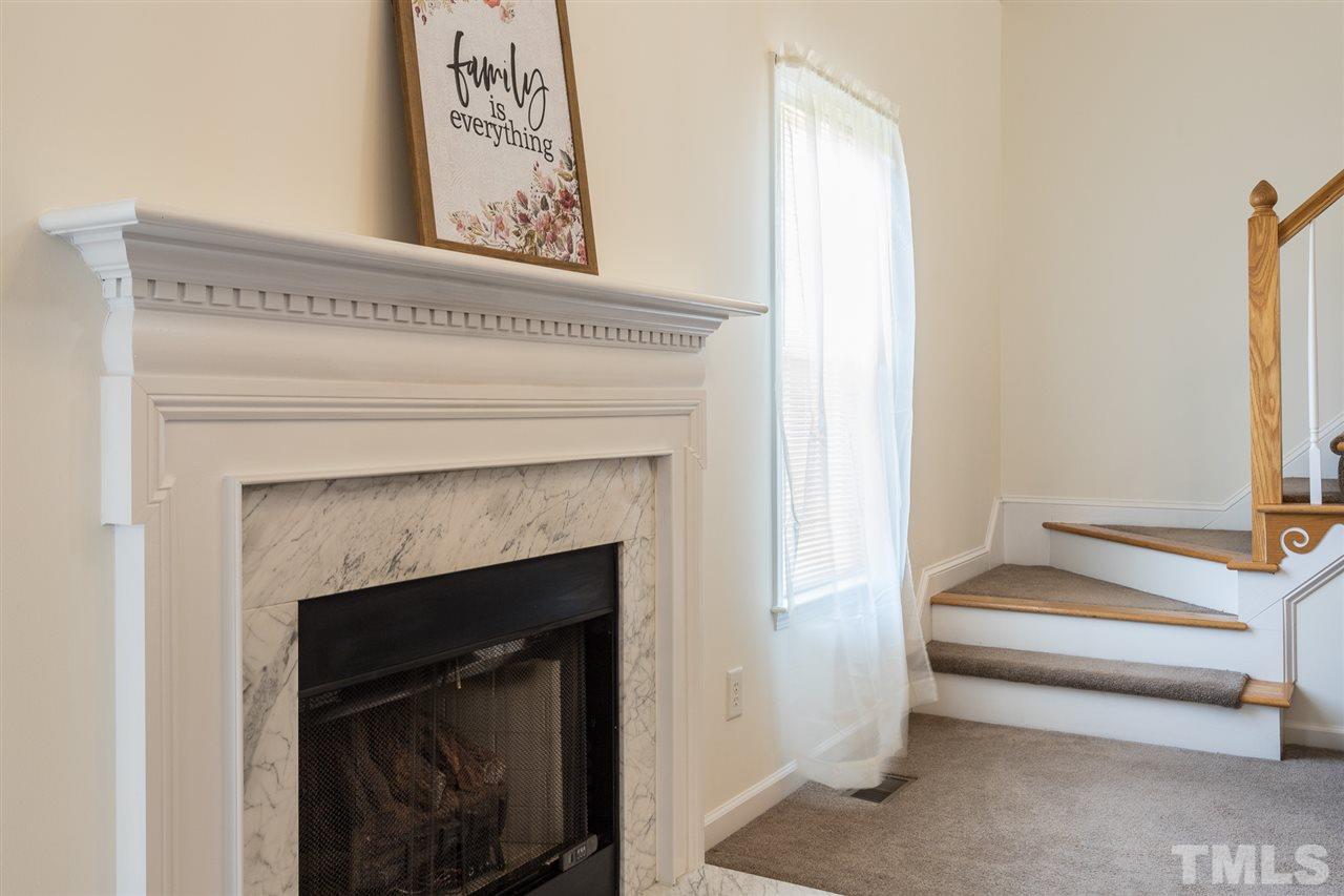 8509 Ridgebury Road Raleigh, NC 27603 - Photo 8 of 30 a living room with a fireplace