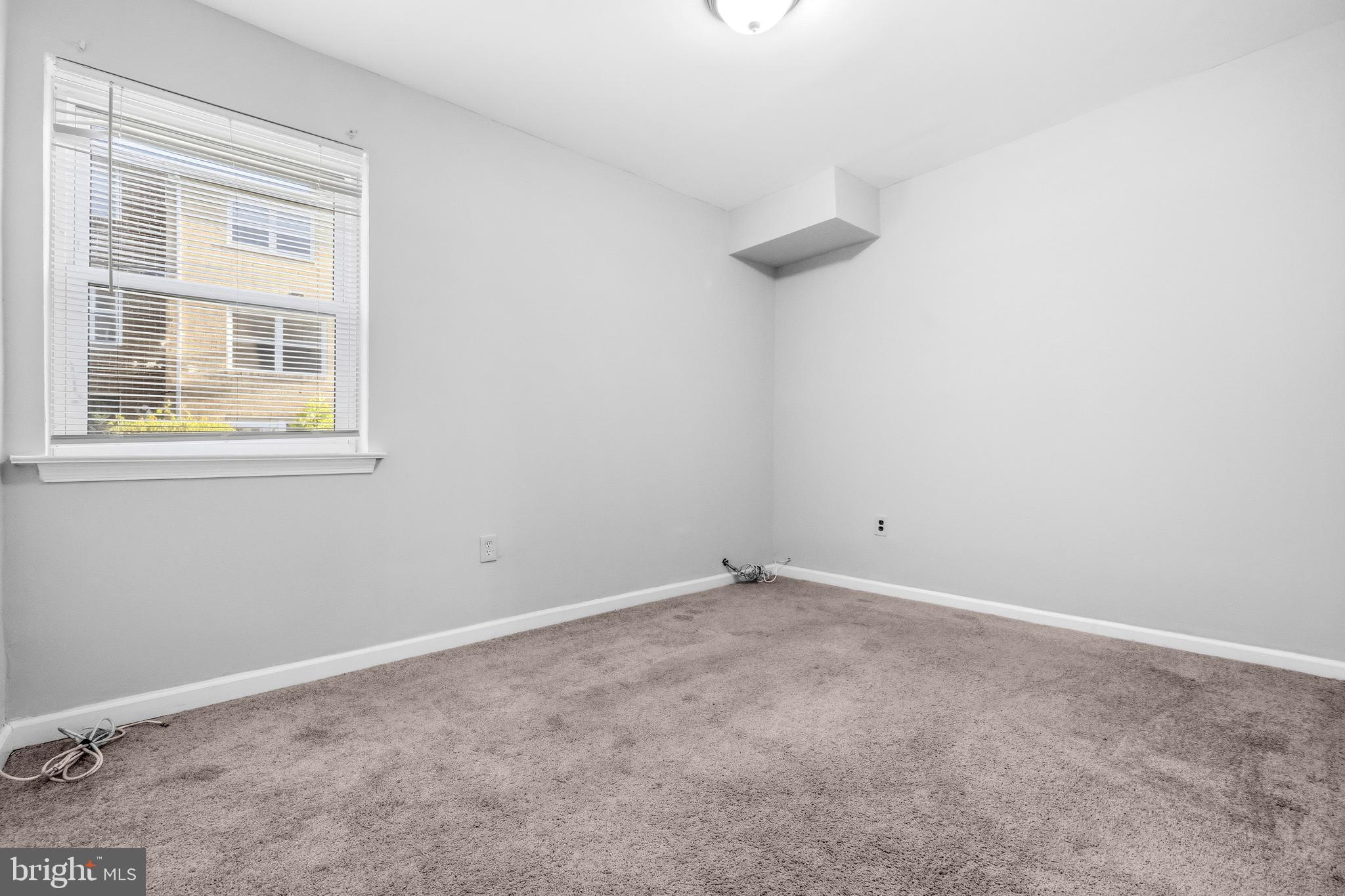 1983 Addison Road South District Heights, MD 20747 - Photo 19 of 32 an empty room with windows