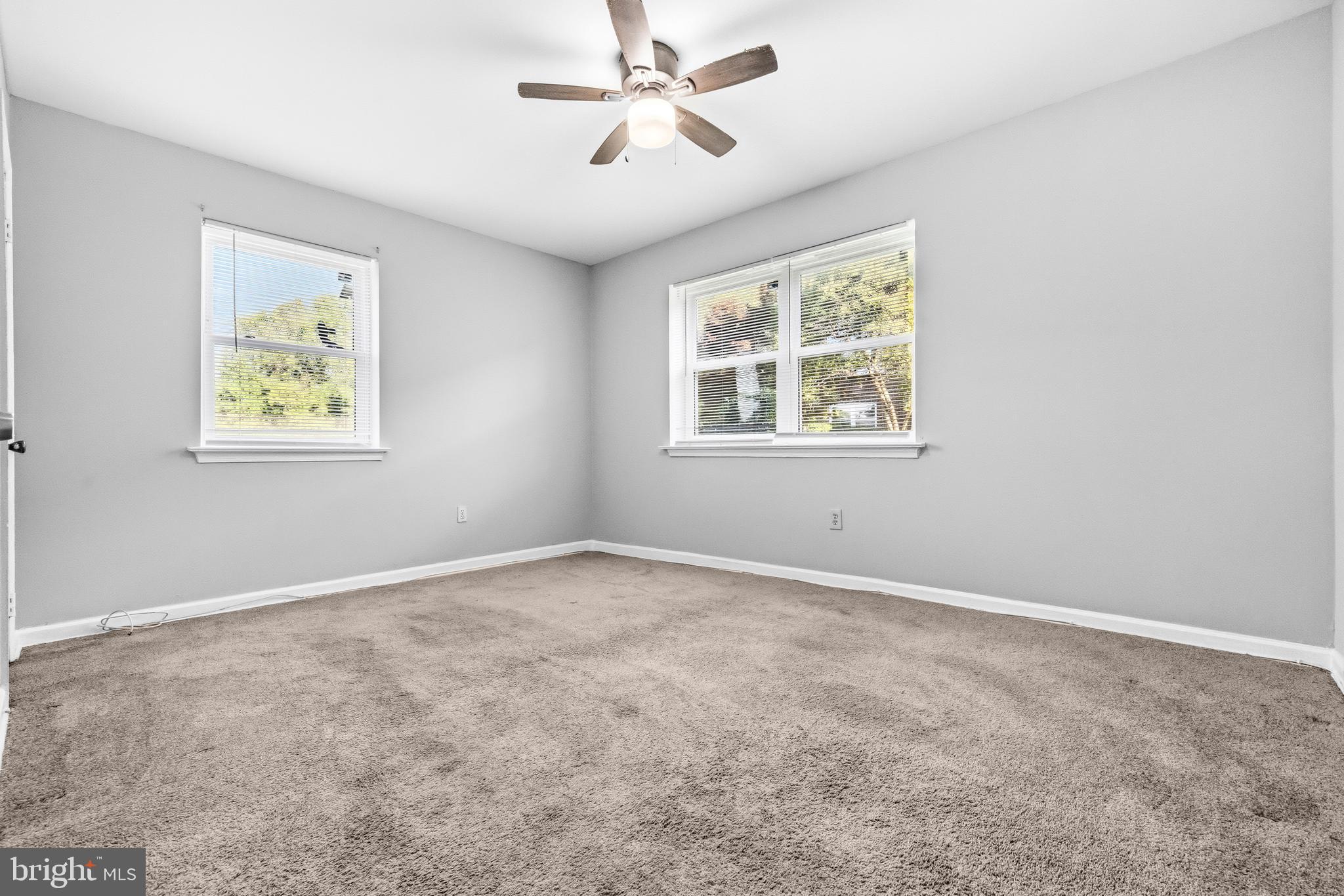 1983 Addison Road South District Heights, MD 20747 - Photo 21 of 32 an empty room with windows and fan