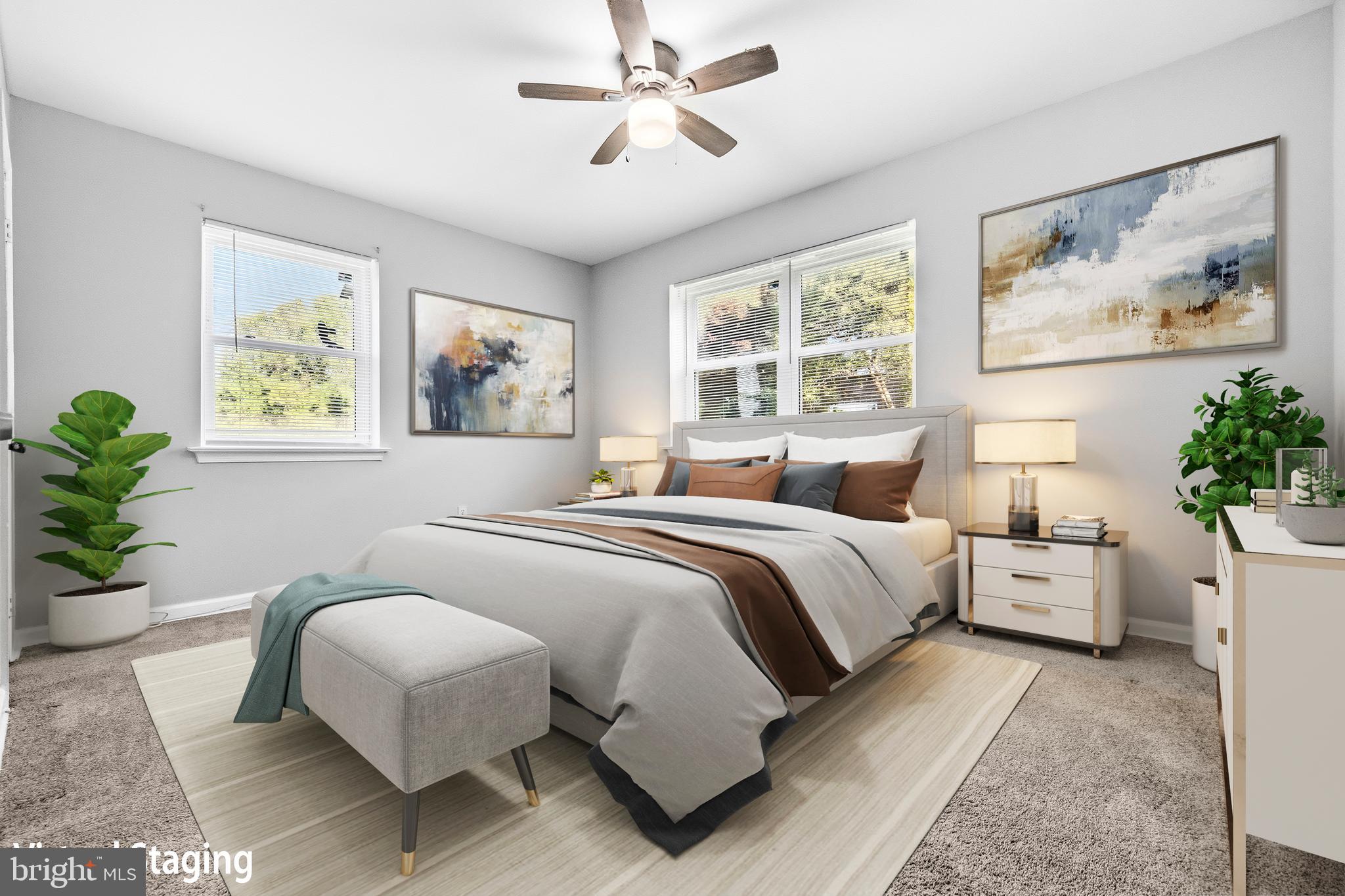 1983 Addison Road South District Heights, MD 20747 - Photo 22 of 32 a spacious bedroom with a large bed and a chandelier
