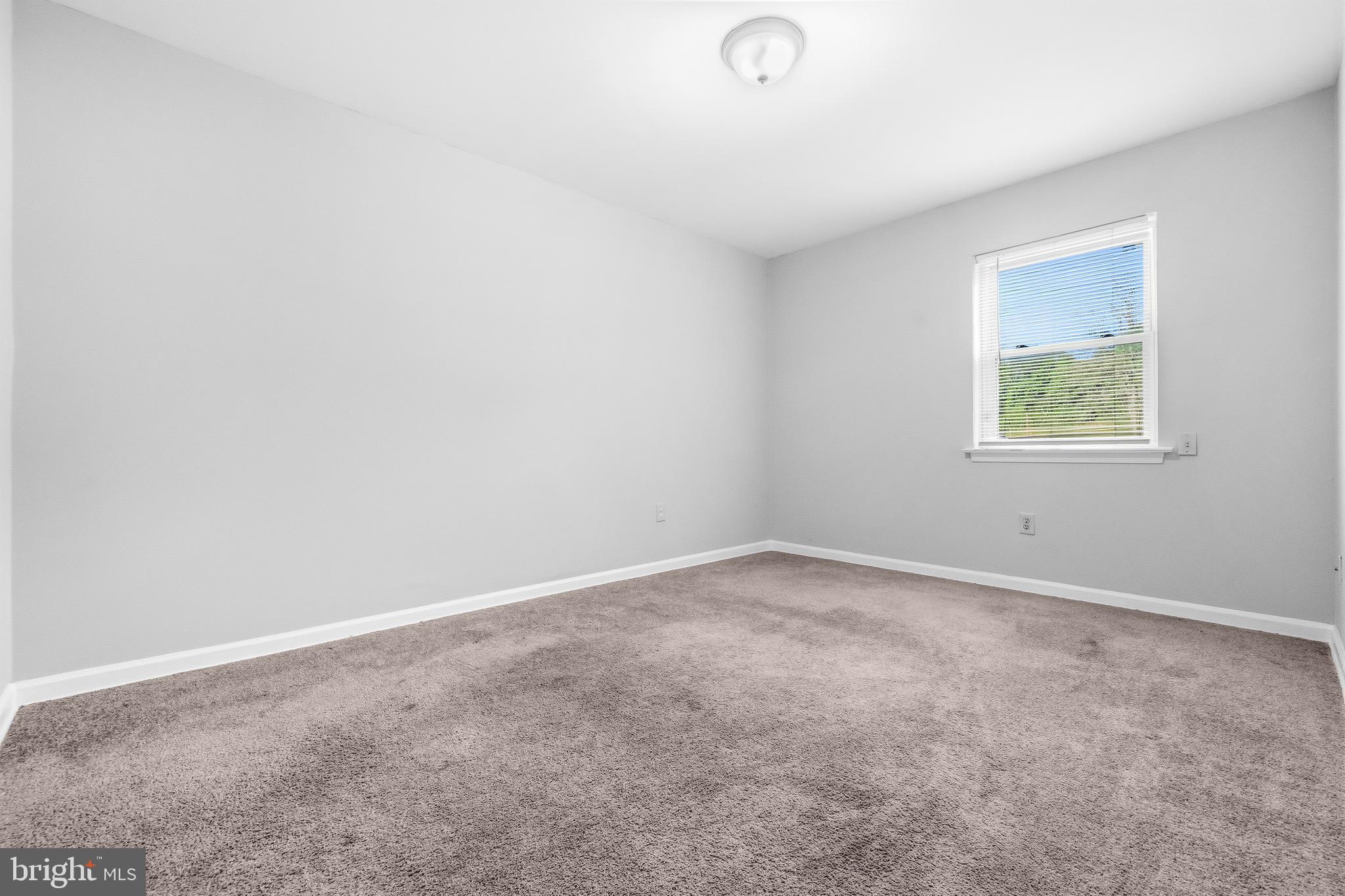 1983 Addison Road South District Heights, MD 20747 - Photo 25 of 32 an empty room with a window