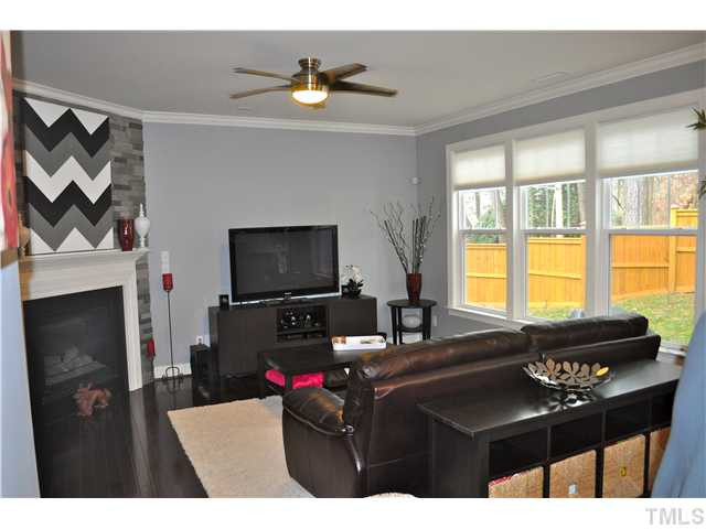 808 Pirouette Court Raleigh, NC 27606 - Photo 4 of 25 Family room with gas log fireplace and great view of the yard. Den/Family/Great Room