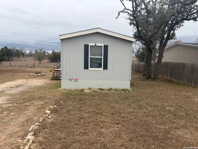 a house with trees in the background