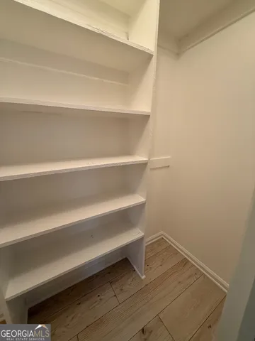 a view of small space with racks on the wall