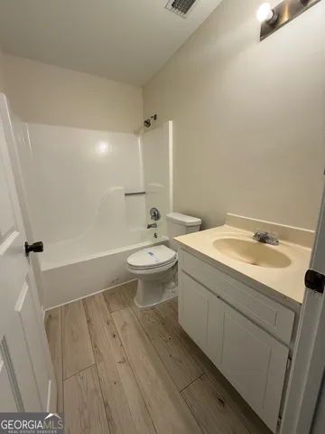 a bathroom with a sink and mirror