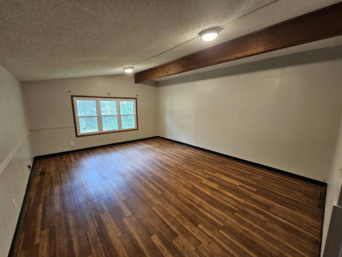 2875 North Vine Street Decatur, IL 62526 - Photo 18 of 19 a view of an empty room with wooden floor and a window
