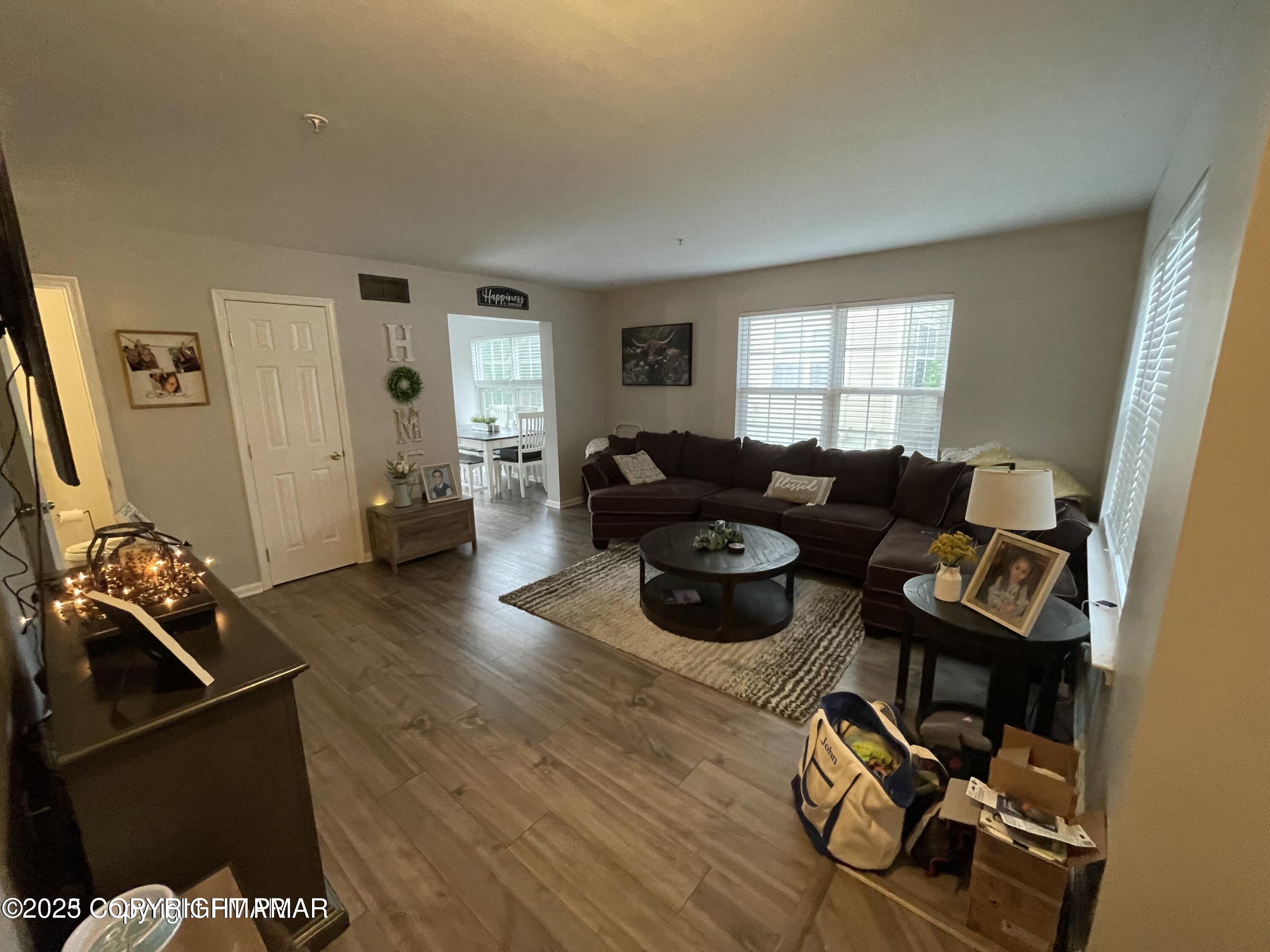 51 Lower Ridgeview Circle East Stroudsburg, PA 18302 - Photo 6 of 10 a living room with furniture and a flat screen tv