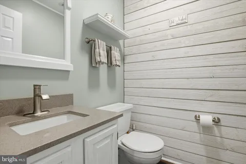 a bathroom with a toilet and a sink