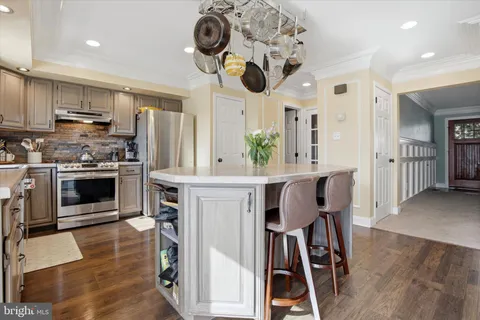 an open kitchen with a table and chairs