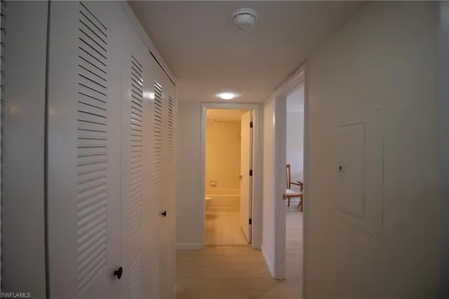 a view of a hallway with washer and dryer