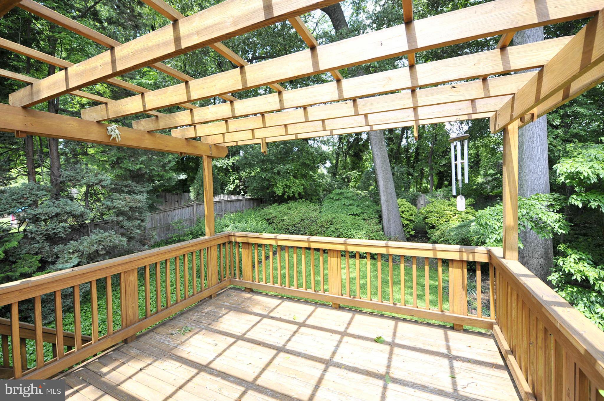 5609 Ridgefield Road Bethesda, MD 20816 - Photo 14 of 15 a view of a wooden deck with a yard