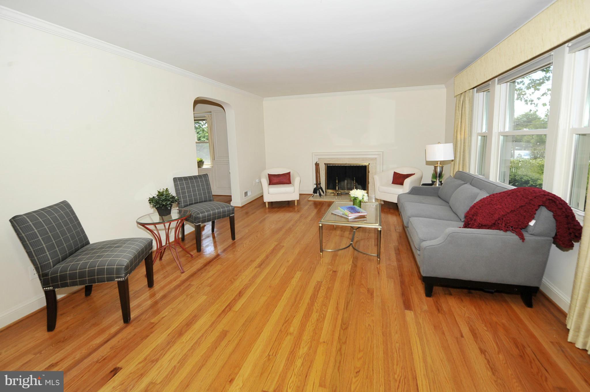 5609 Ridgefield Road Bethesda, MD 20816 - Photo 3 of 15 a living room with furniture and a fireplace