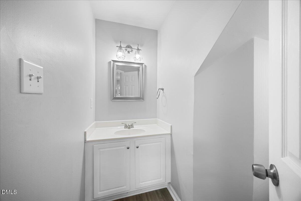 2708 Ferrand Drive Durham, NC 27705 - Photo 15 of 47 a view of a sink and a mirror