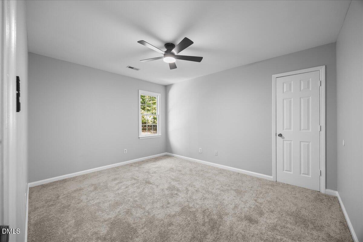2708 Ferrand Drive Durham, NC 27705 - Photo 25 of 47 a view of an empty room with a window