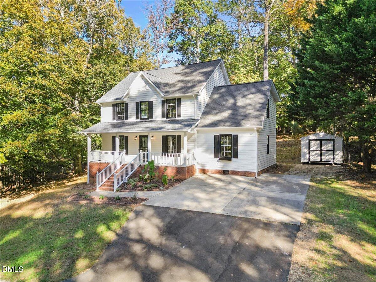 2708 Ferrand Drive Durham, NC 27705 - Photo 2 of 47 a view of a house with a yard