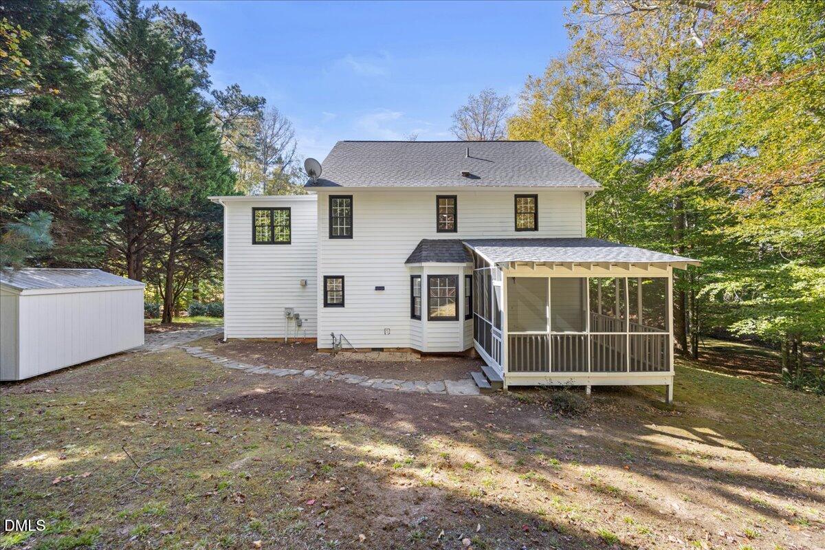 2708 Ferrand Drive Durham, NC 27705 - Photo 38 of 47 a view of a house with a yard and garage