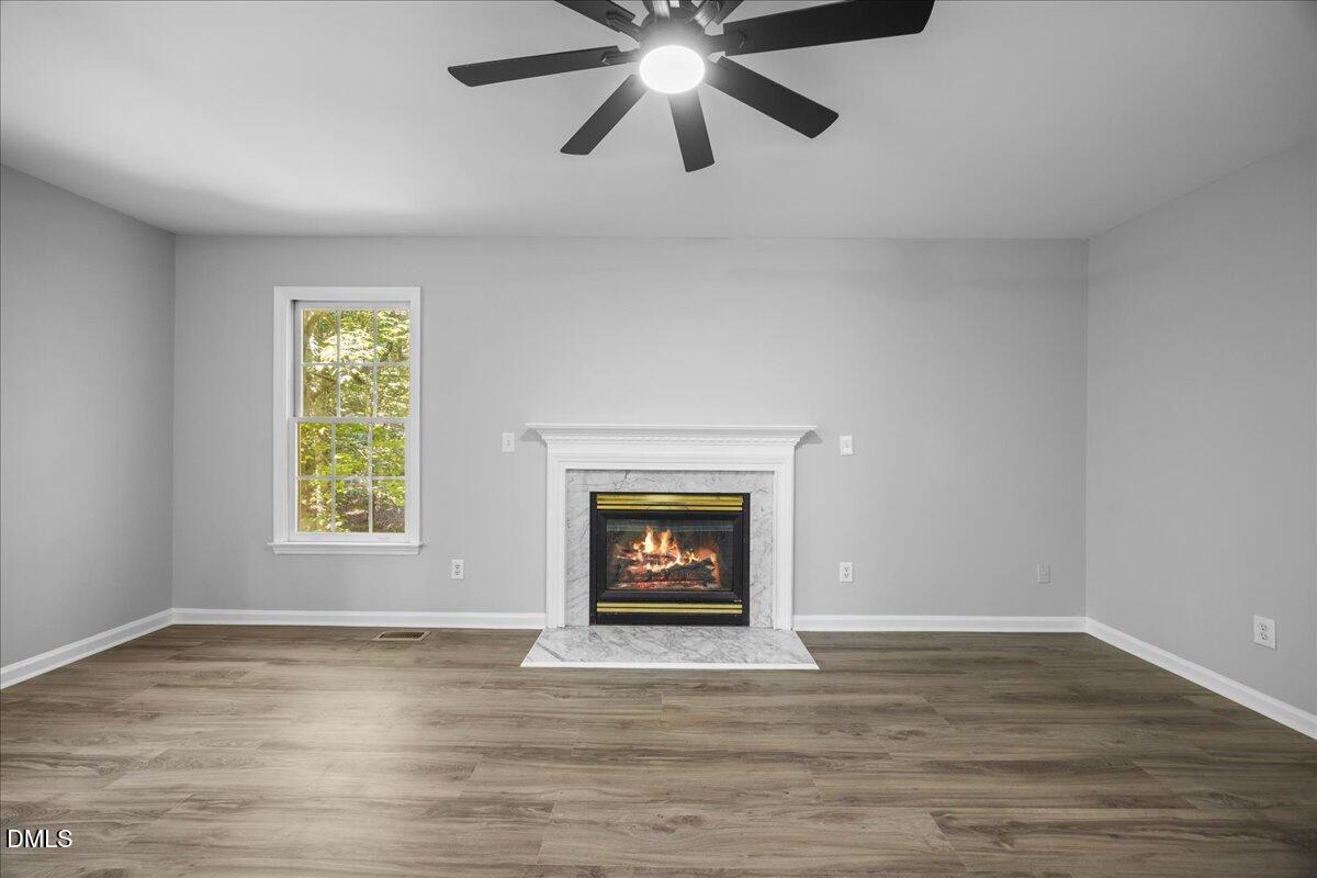 2708 Ferrand Drive Durham, NC 27705 - Photo 6 of 47 a view of an empty room with window and fire place